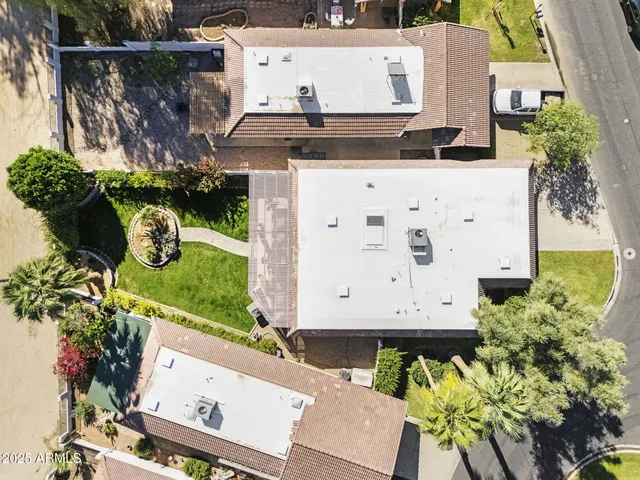 a view of a house with pool and a yard