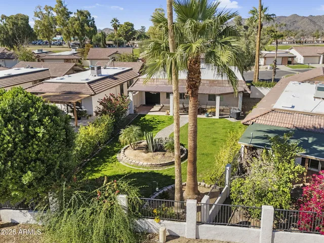 an aerial view of residential house with outdoor space and swimming pool