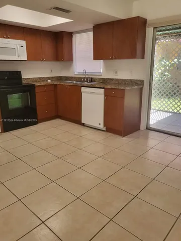 a bathroom with a sink toilet and mirror