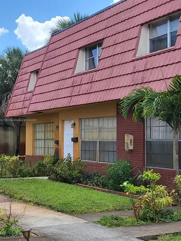 en empty room with wooden floor