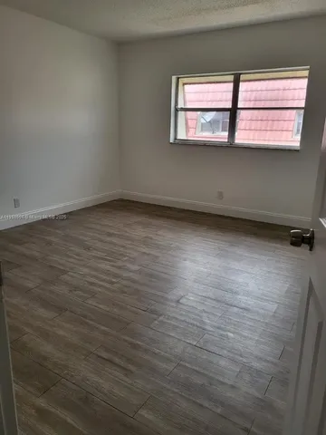 a kitchen with a window a sink and a cabinets