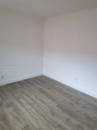 a bath room with a toilet and a bath tub