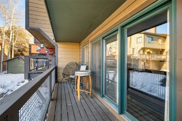 a bedroom with a bed and a flat tv screen