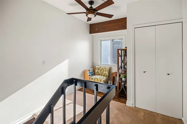 a bedroom with a bed and a night stand