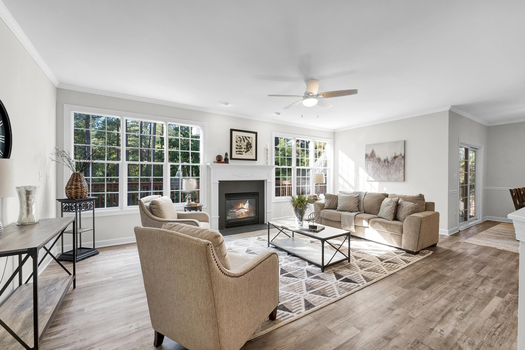 6914 Wexford Woods Trail Raleigh, NC 27613 - Photo 11 of 37 a living room with furniture and a fireplace