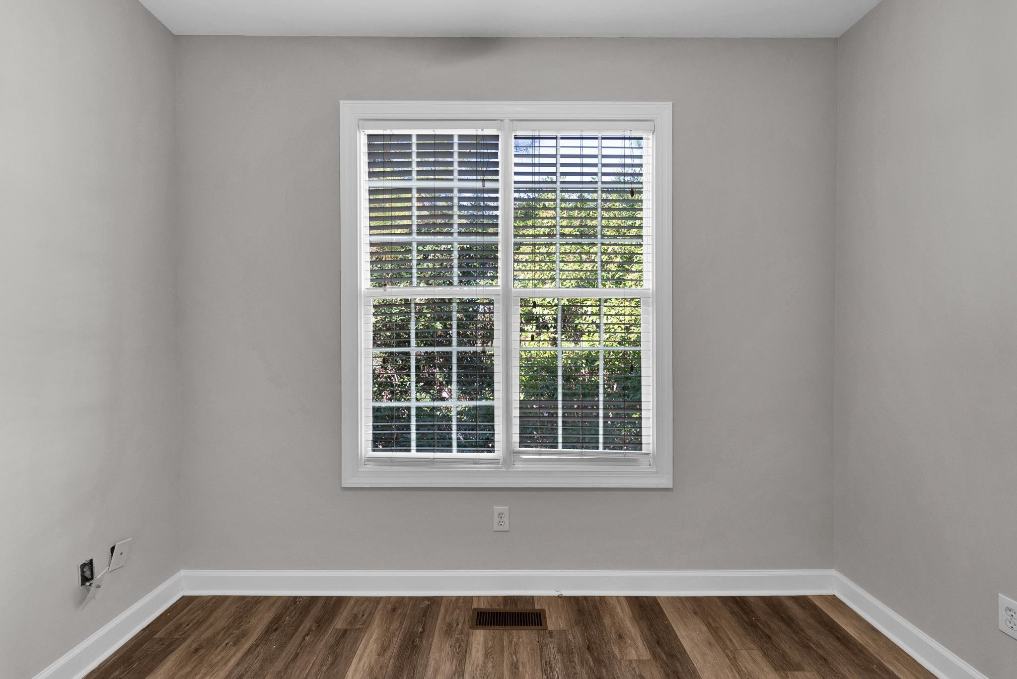 6914 Wexford Woods Trail Raleigh, NC 27613 - Photo 17 of 37 a view of wooden floor with a window