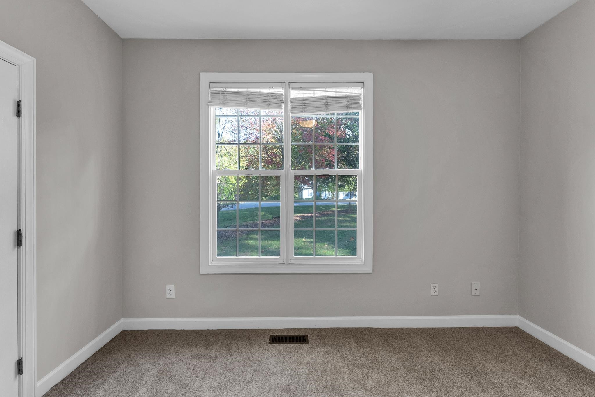 6914 Wexford Woods Trail Raleigh, NC 27613 - Photo 20 of 37 an empty room with a window