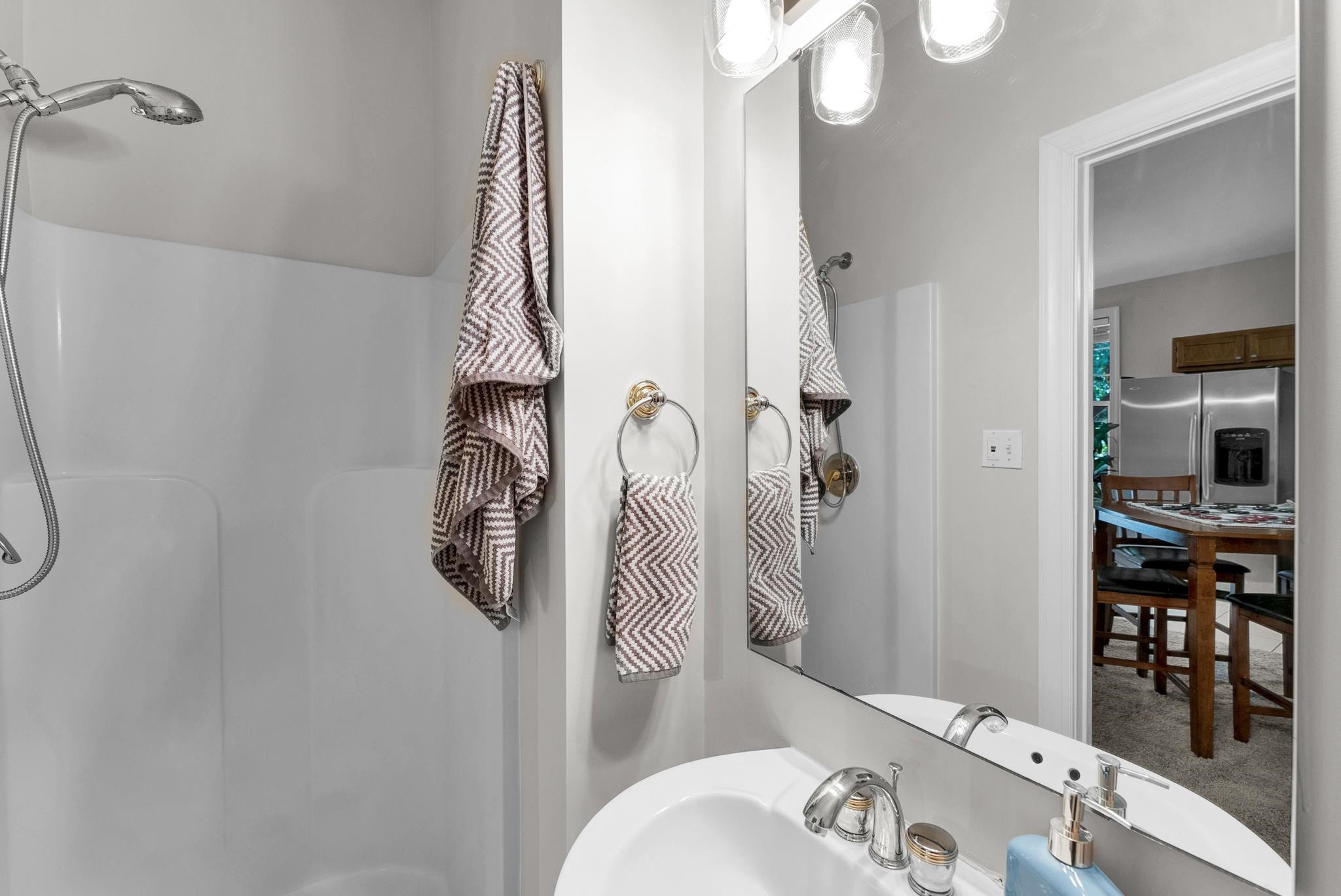 6914 Wexford Woods Trail Raleigh, NC 27613 - Photo 26 of 37 a bathroom with a sink vanity mirror and toilet