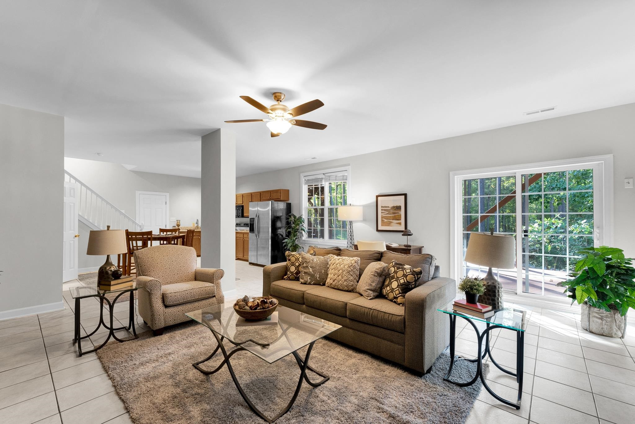 6914 Wexford Woods Trail Raleigh, NC 27613 - Photo 28 of 37 a living room with furniture and a large window