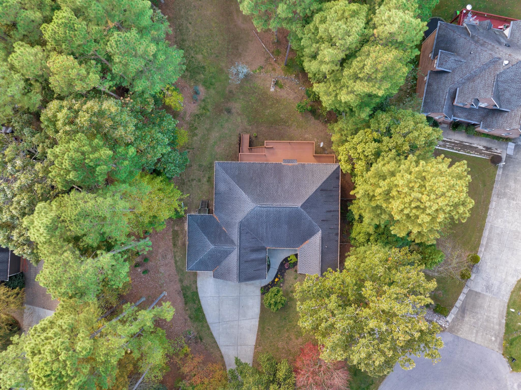 6914 Wexford Woods Trail Raleigh, NC 27613 - Photo 3 of 37 an aerial view of a house with a yard
