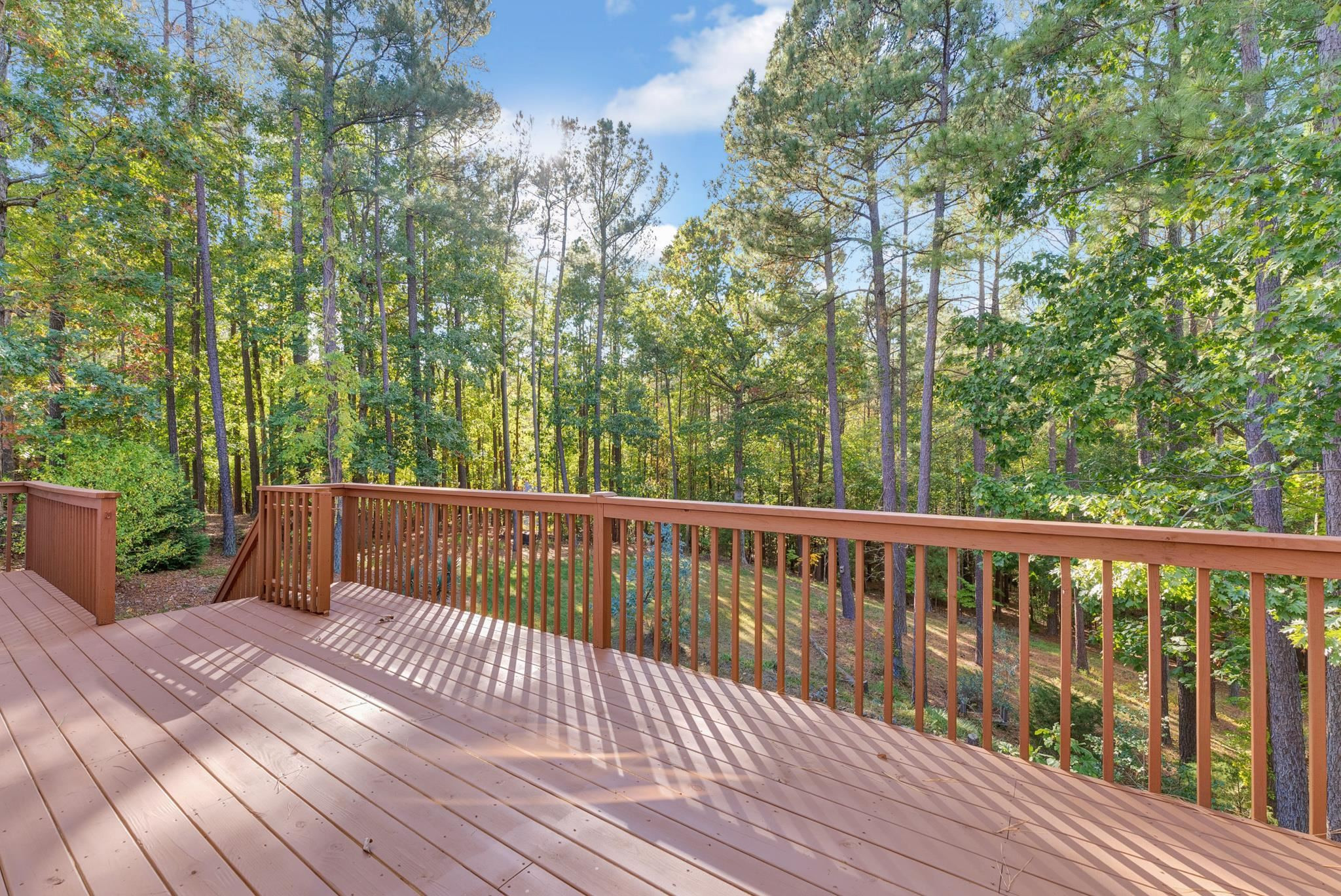 6914 Wexford Woods Trail Raleigh, NC 27613 - Photo 32 of 37 a view of balcony with wooden floor and outdoor space