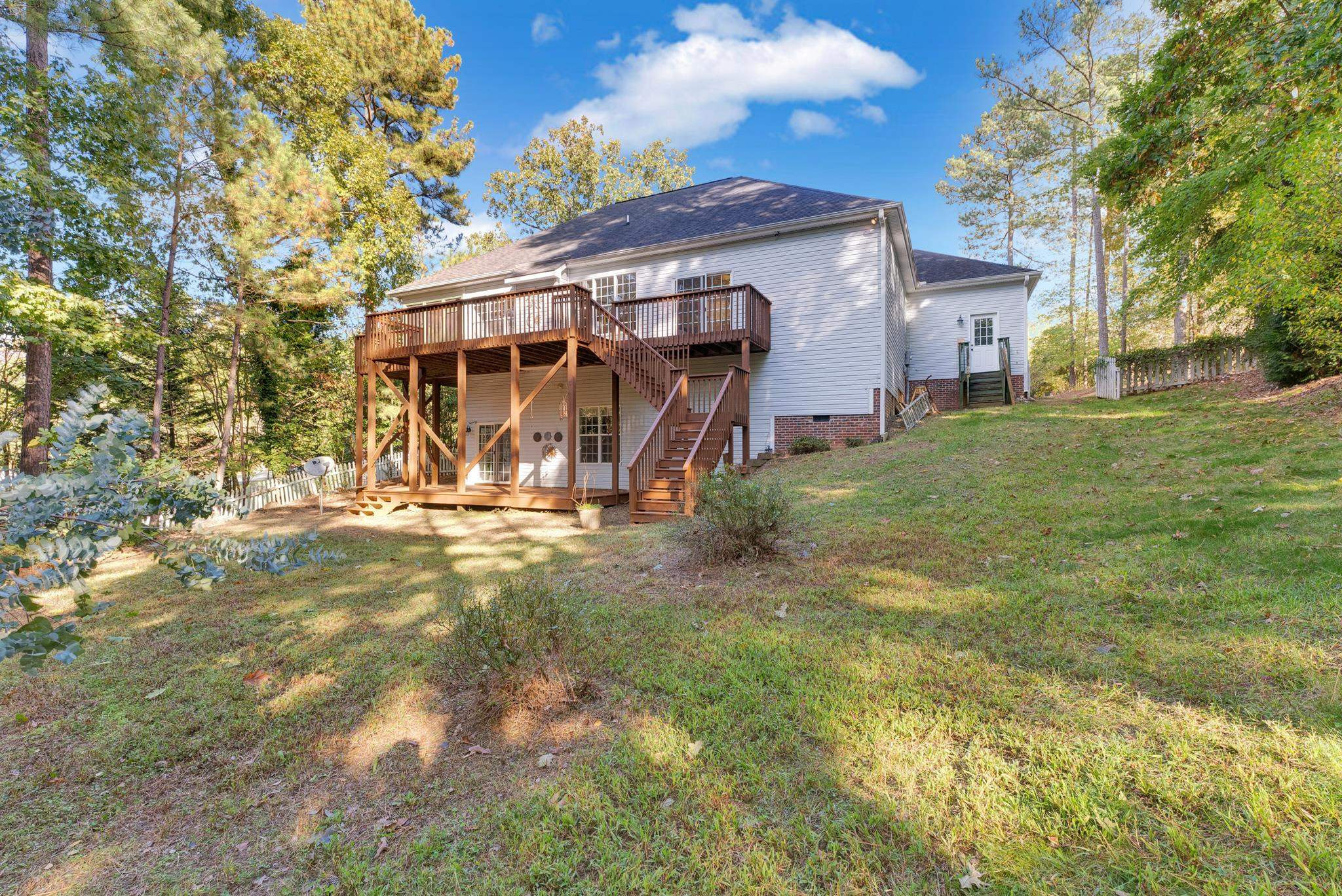 6914 Wexford Woods Trail Raleigh, NC 27613 - Photo 34 of 37 a view of a house with a yard