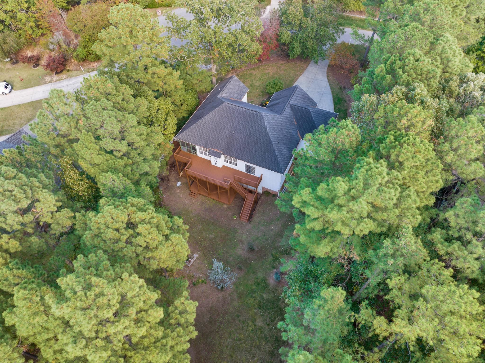 6914 Wexford Woods Trail Raleigh, NC 27613 - Photo 37 of 37 an aerial view of a house with a yard