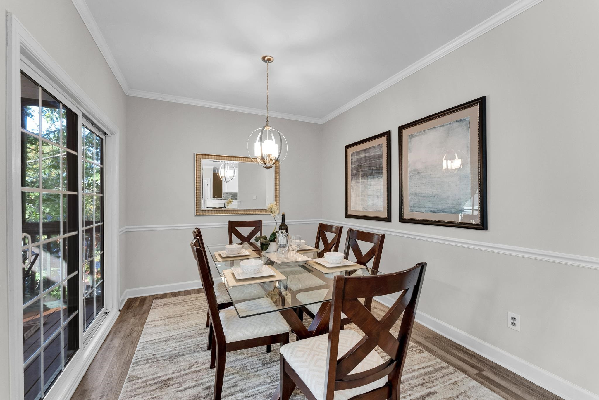 6914 Wexford Woods Trail Raleigh, NC 27613 - Photo 8 of 37 a view of a dining room with furniture window and wooden floor