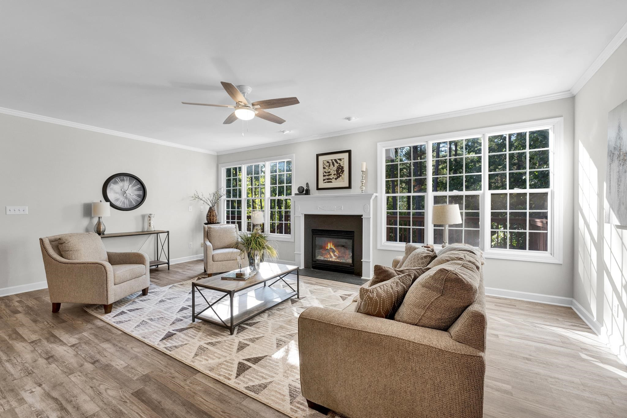 6914 Wexford Woods Trail Raleigh, NC 27613 - Photo 9 of 37 a living room with furniture and a fireplace
