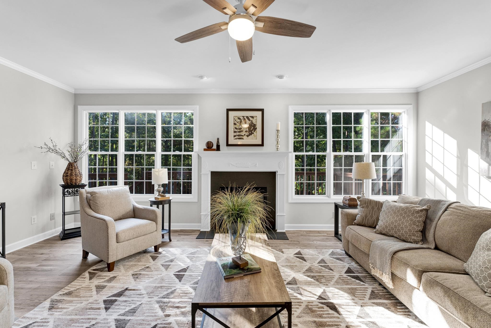 6914 Wexford Woods Trail Raleigh, NC 27613 - Photo 10 of 37 a living room with furniture and a large window