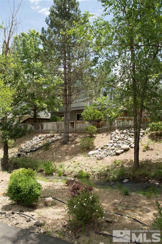 669 Caughlin Glen Reno, NV 89519 - Photo 25 of 25 a view of a yard with plants and large trees