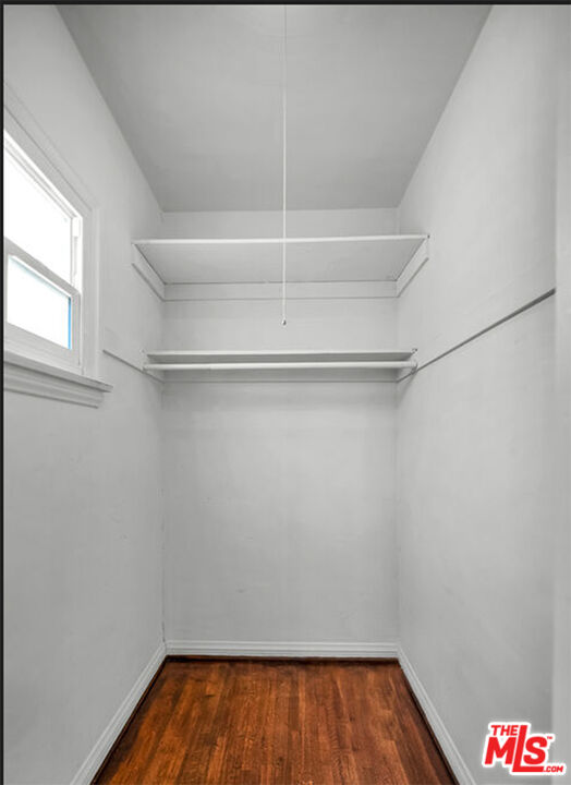 6369 Orange Street Los Angeles, CA 90048 - Photo 13 of 23 a room with linen closet and wooden floor