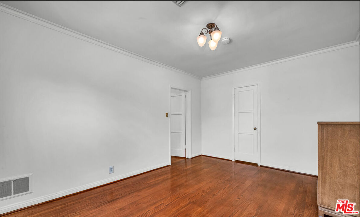 6369 Orange Street Los Angeles, CA 90048 - Photo 20 of 23 a view of empty room with wooden floor