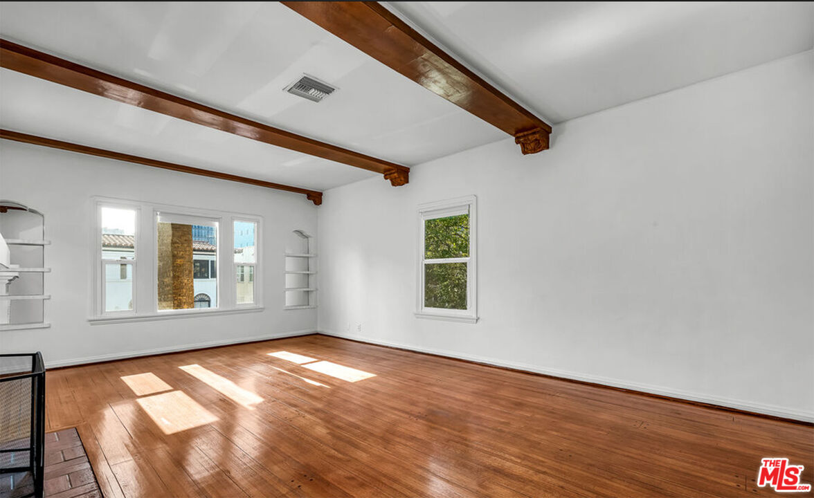 6369 Orange Street Los Angeles, CA 90048 - Photo 4 of 23 a view of empty room with windows