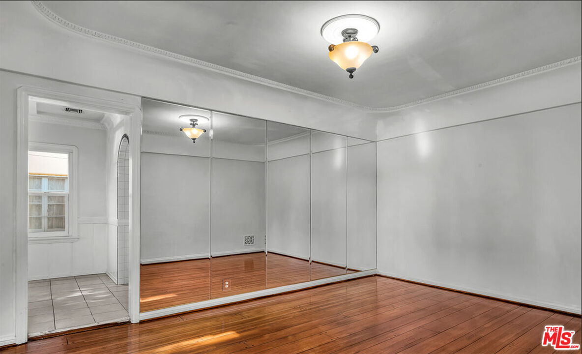 6369 Orange Street Los Angeles, CA 90048 - Photo 6 of 23 a view of empty room with wooden floor