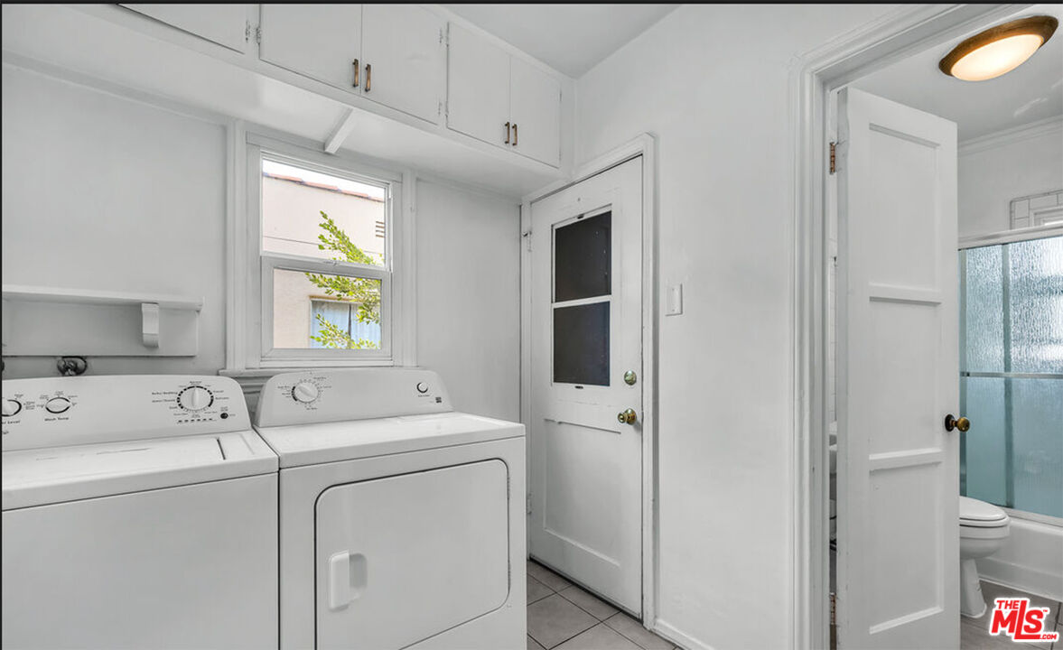 6369 Orange Street Los Angeles, CA 90048 - Photo 9 of 23 a utility room with dryer and washer