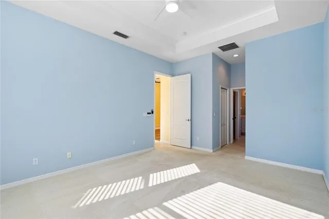 a bathroom with a tub a sink and a large mirror