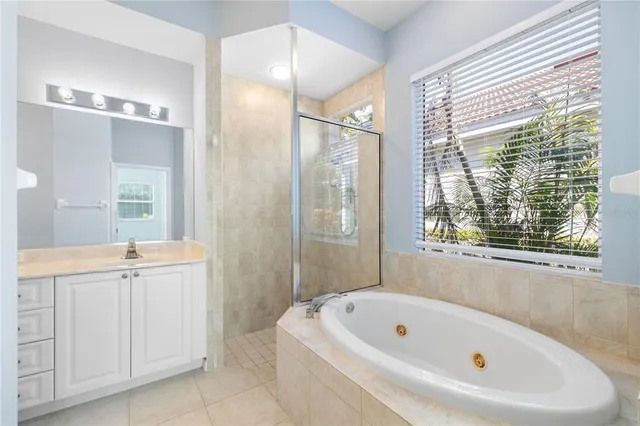 a bathroom with a sink double vanity and a mirror