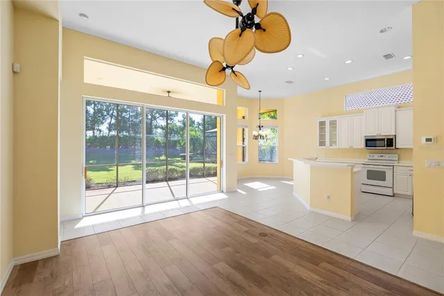 a kitchen with stainless steel appliances granite countertop a refrigerator and a stove