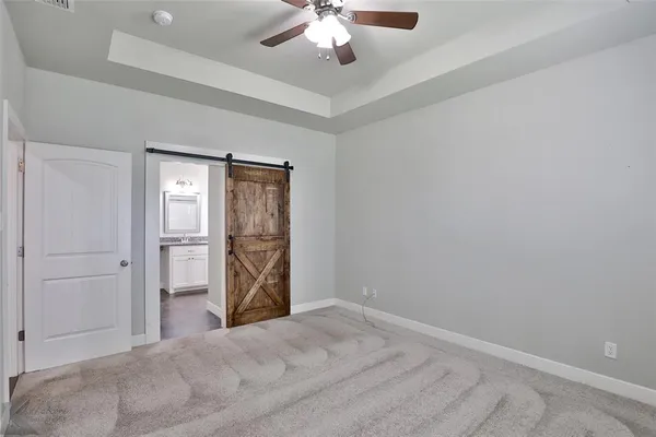 a view of a livingroom with a chandelier fan and closet