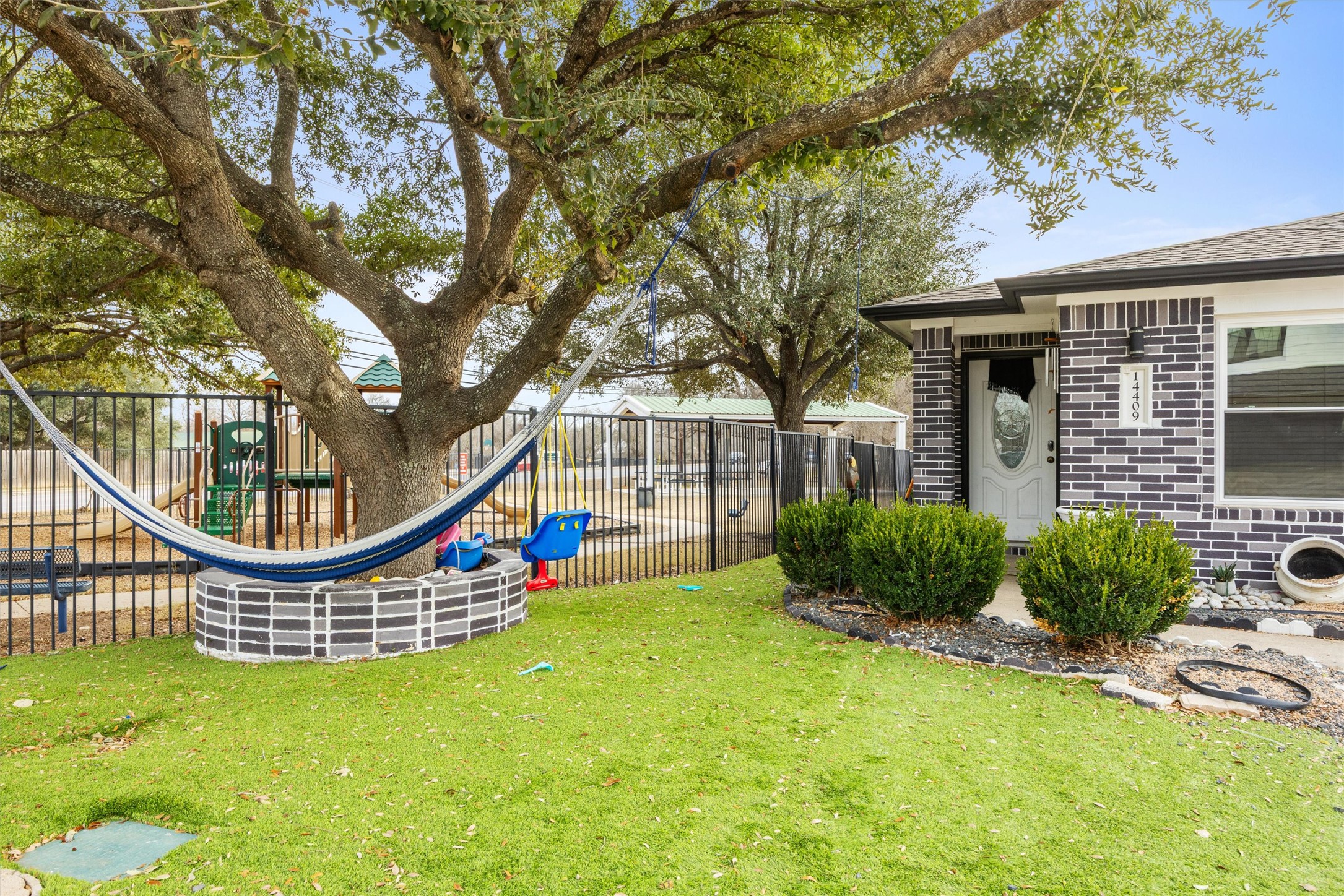 14409 Sandifer Street Austin, TX 78725 - Photo 28 of 31 View of yard featuring a playground