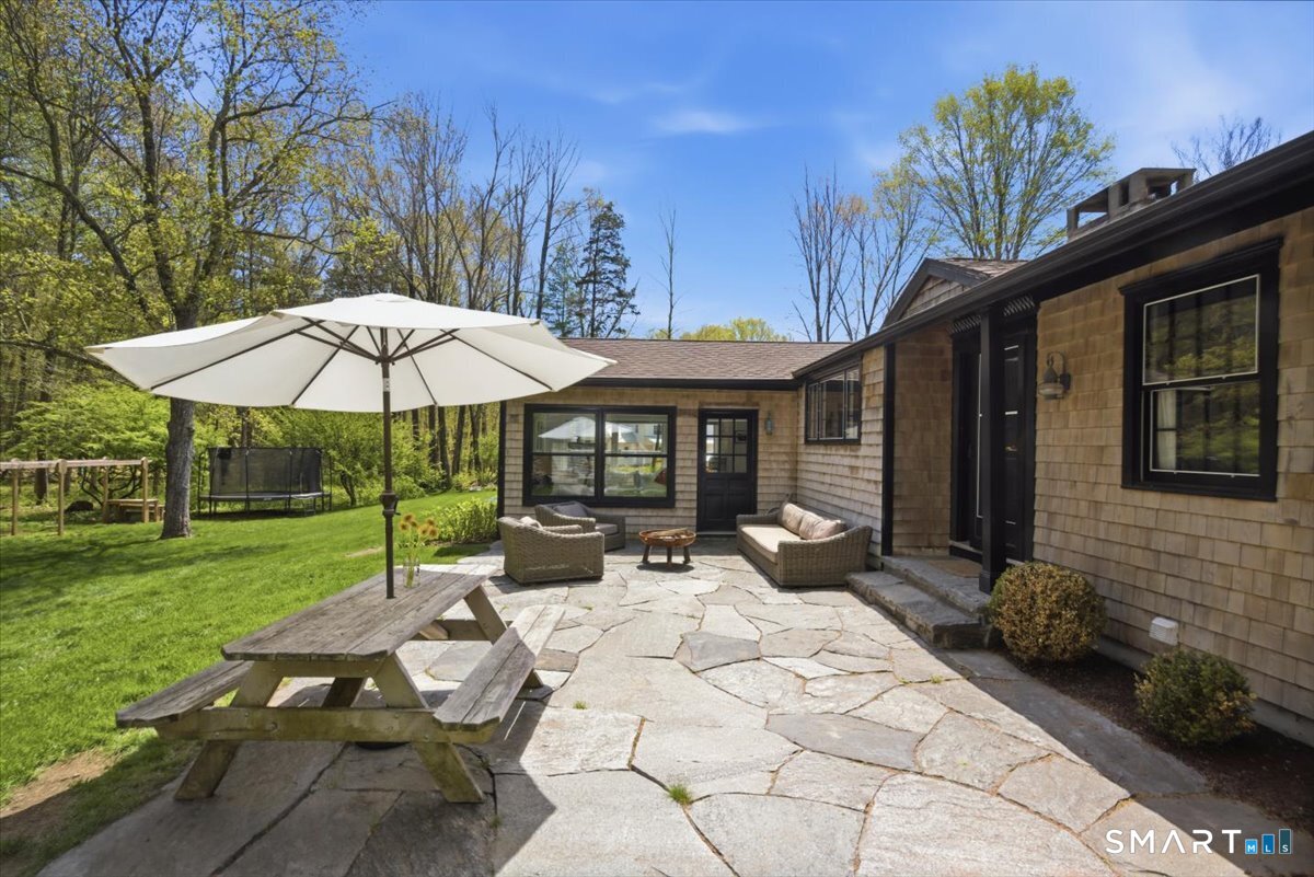 246 North Street Roxbury, CT 06783 - Photo 17 of 22 Stone patio accessed from kitchen and sunroom.