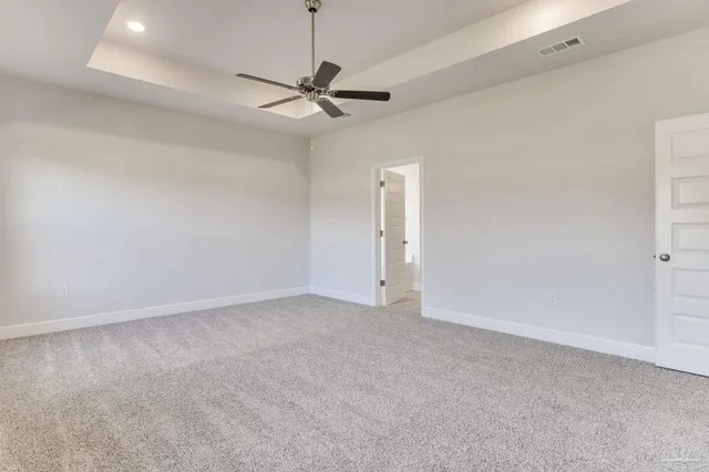 an empty room with a empty space and a ceiling fan