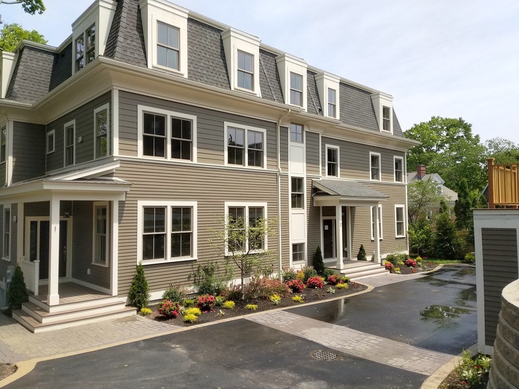 33 Winthrop Road, Unit 1 Brookline, MA 02445 - Photo 1 of 1 a front view of a building with many windows