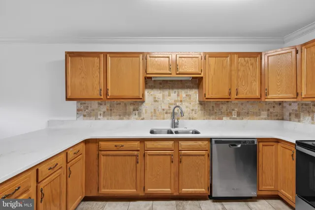 a kitchen with stainless steel appliances granite countertop a sink and a cabinets