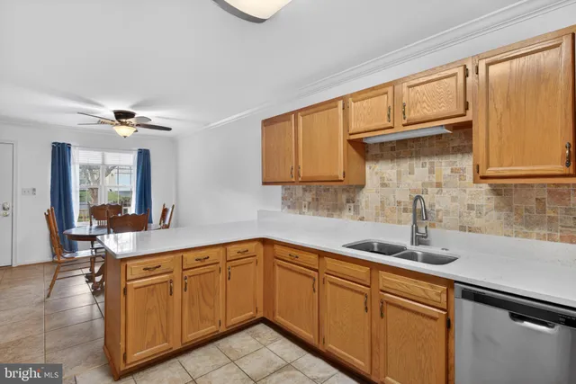 a kitchen with a sink cabinets and window