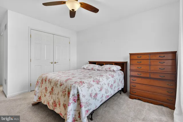 a bedroom with a bed and closet