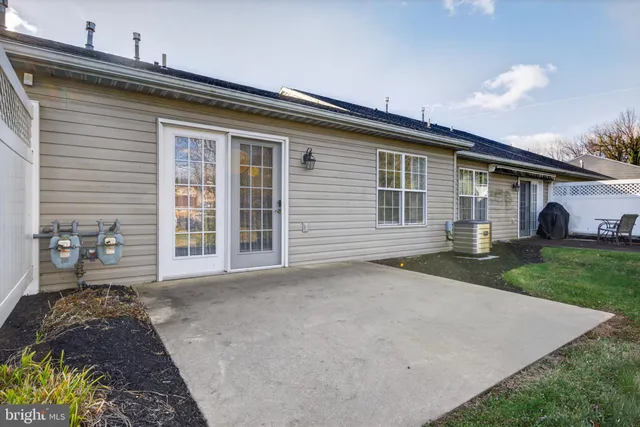 a view of a backyard with sitting area