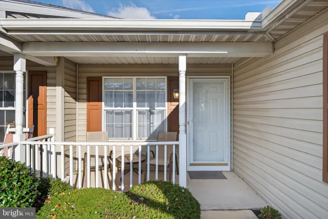 a view of a porch with a bench