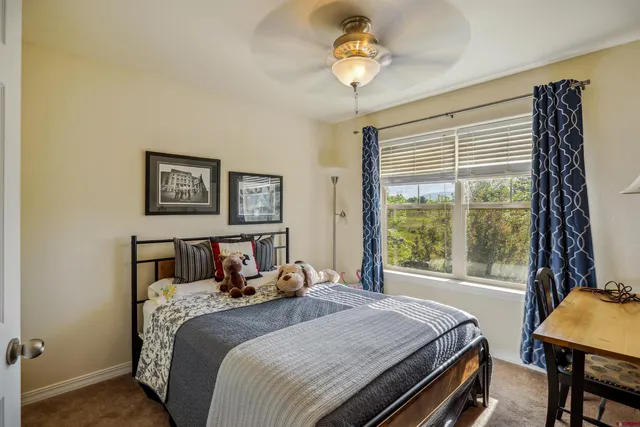 an aerial view of a house with yard and lake view