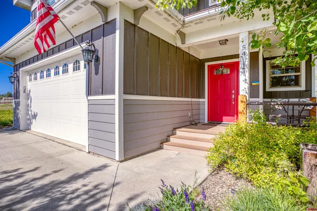 a house with lots of trees in the background