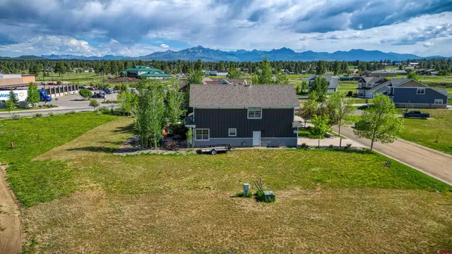 a bedroom with a bed and a wall painting