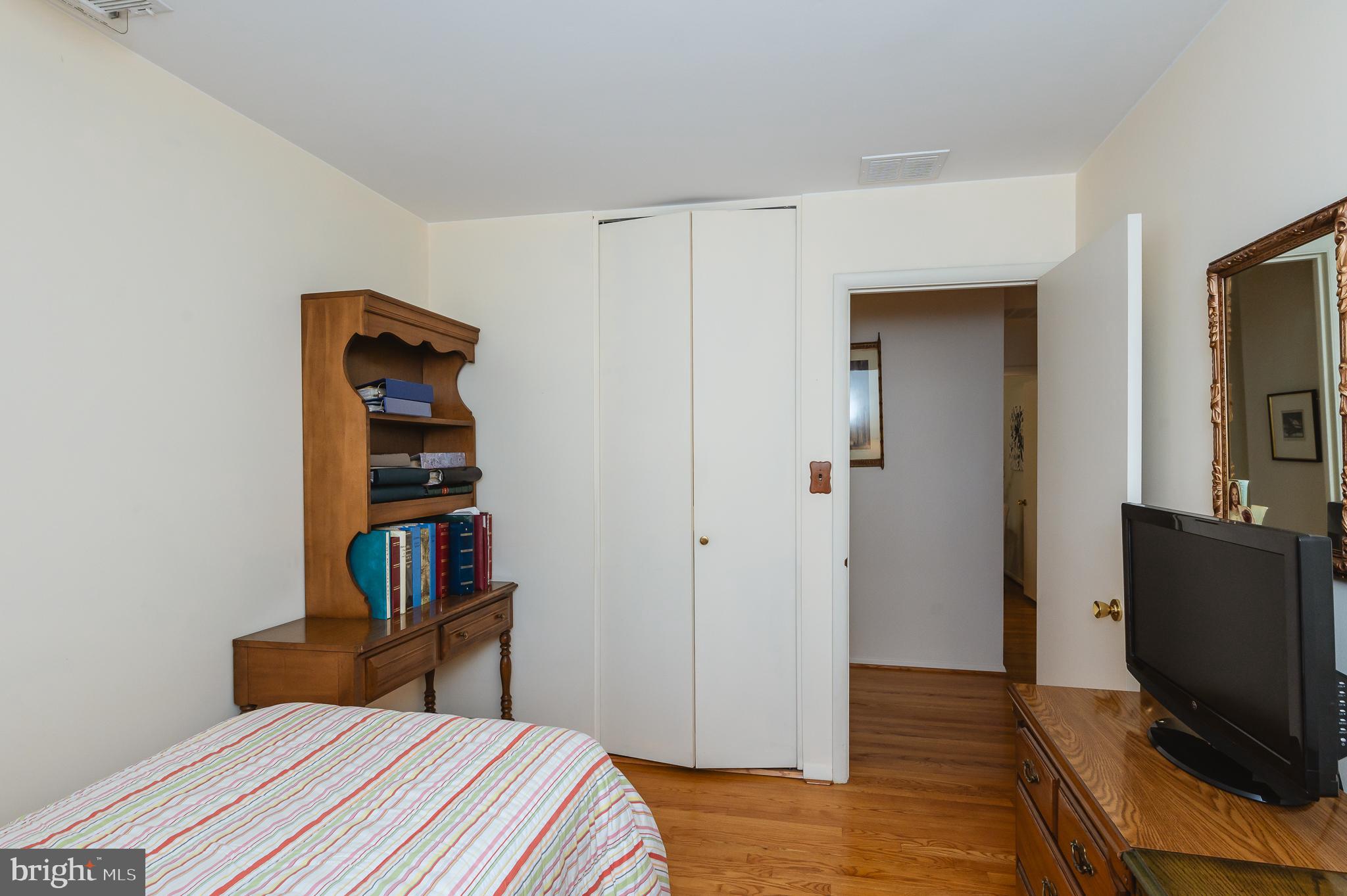 8337 Analee Avenue Rosedale, MD 21237 - Photo 27 of 48 a bedroom with a bed and a television