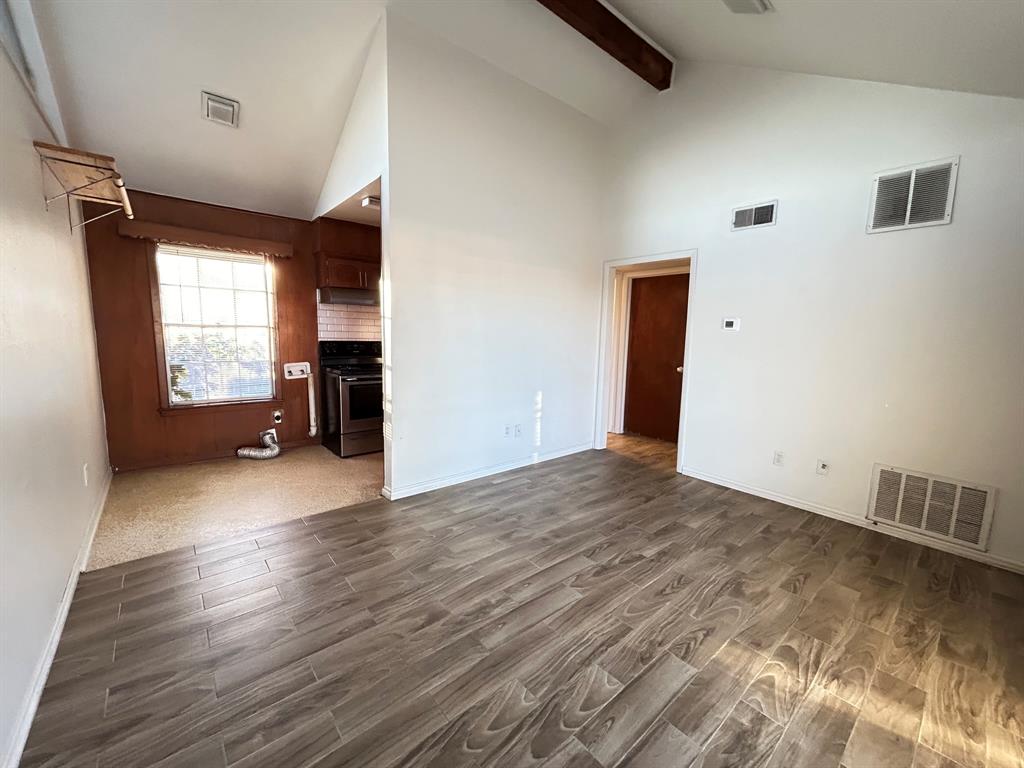 409 Royal Street, Unit 1 Athens, TX 75751 - Photo 2 of 14 a view of empty room with wooden floor and fan