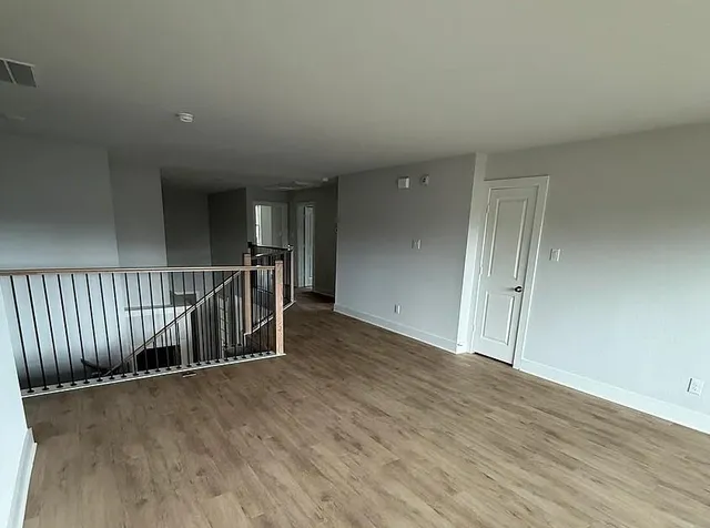a view of entryway with wooden floor