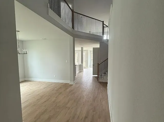 a view of an entryway with wooden floor