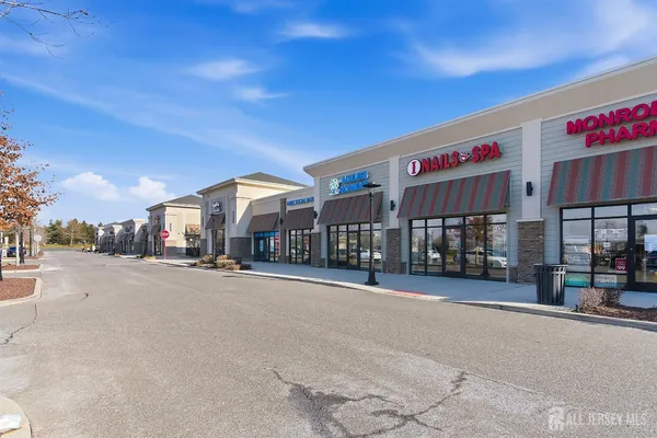 a city street lined with buildings and cars
