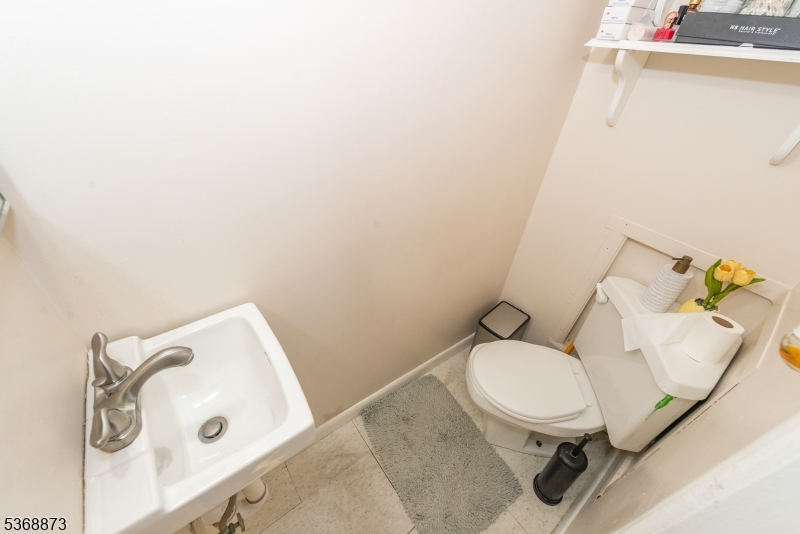 609 Madison Avenue, Unit 2 Paterson, NJ 07514 - Photo 20 of 43 a bathroom with a sink and toilet