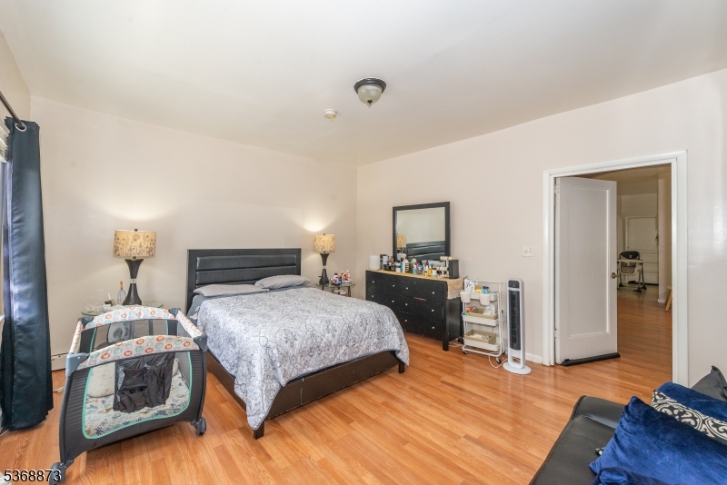 609 Madison Avenue, Unit 2 Paterson, NJ 07514 - Photo 22 of 43 a bedroom with a bed and a view of bedroom