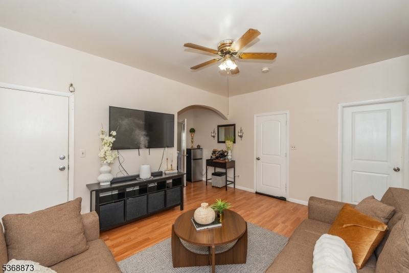 609 Madison Avenue, Unit 2 Paterson, NJ 07514 - Photo 26 of 43 a living room with furniture and a fireplace